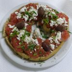 Traditional Cretan Food- Dakos with tomato, olives and mizhthra