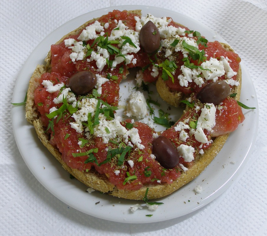 Traditional Cretan Food- Dakos with tomato, olives and mizhthra
